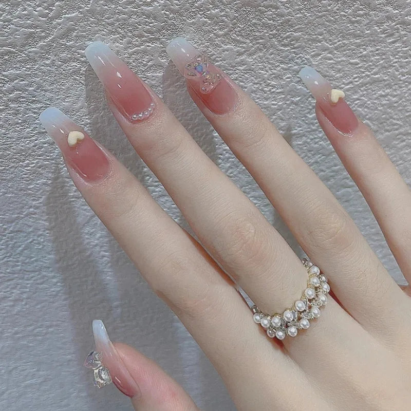 Decorated nail designs shown on hands
