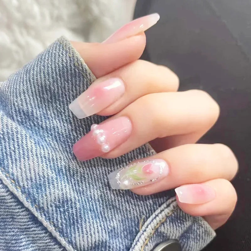 Decorated nail designs shown on hands