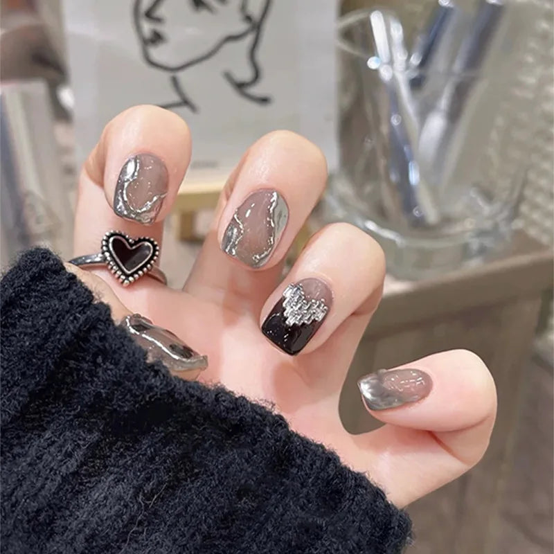 Decorated nail designs shown on hands