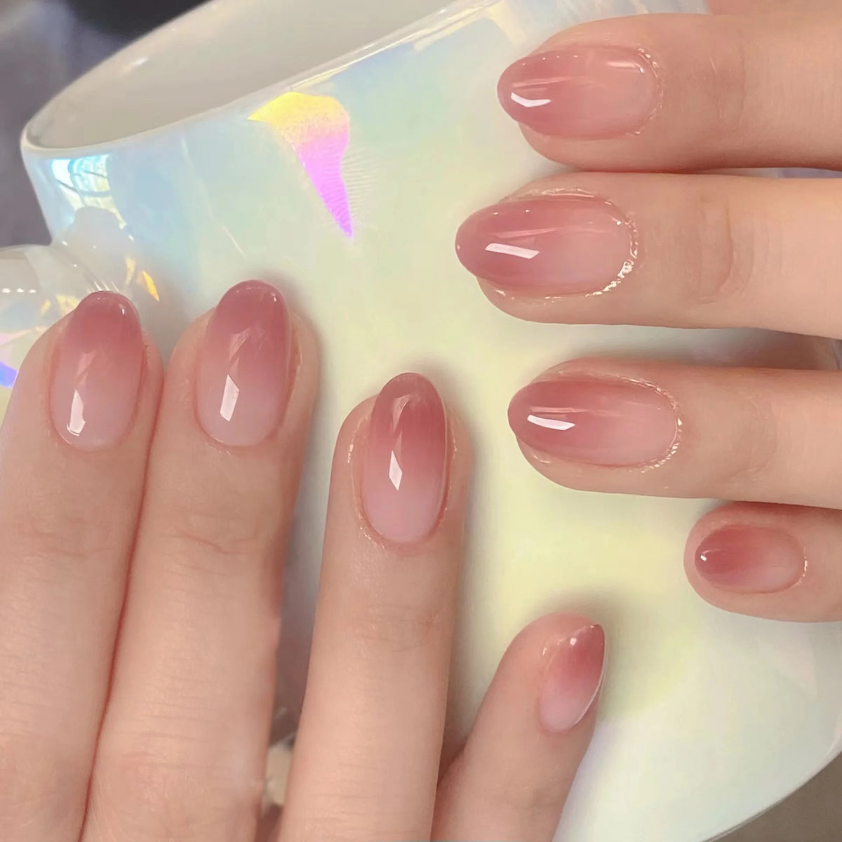 Decorated nail designs shown on hands