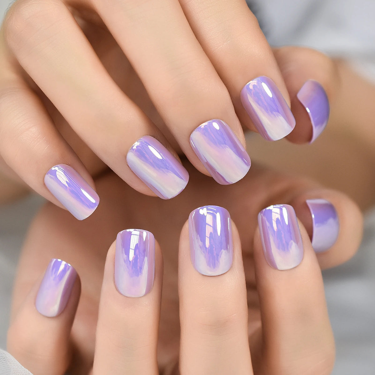 Chrome-finish nails shown on hands