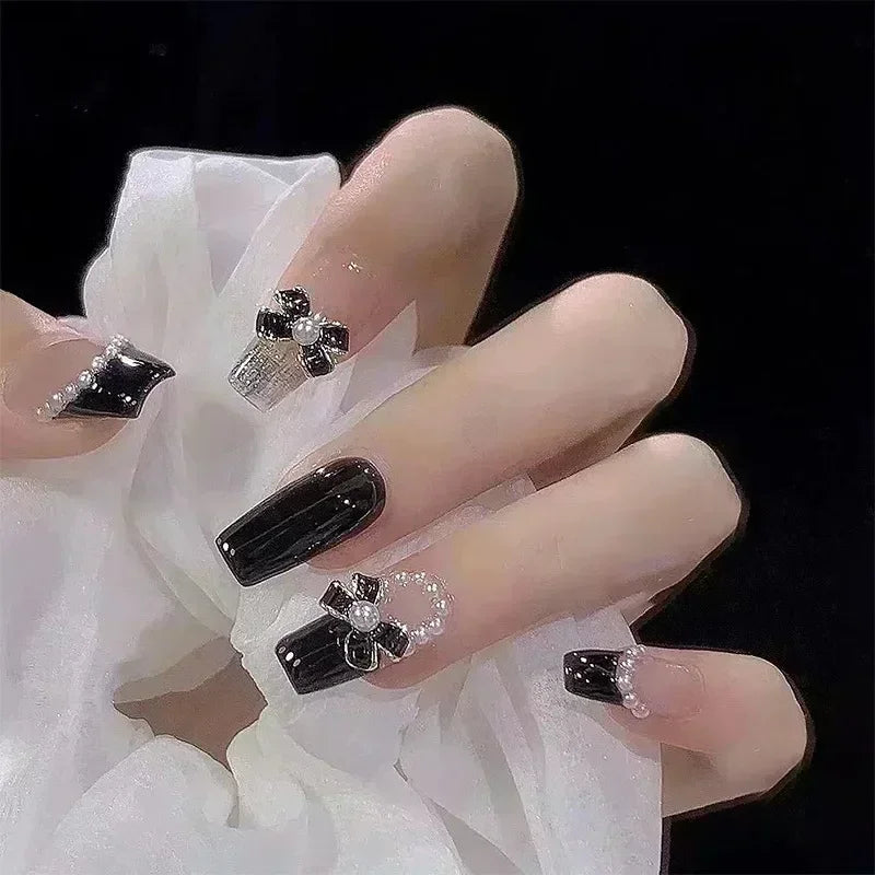Decorated nail designs shown on hands