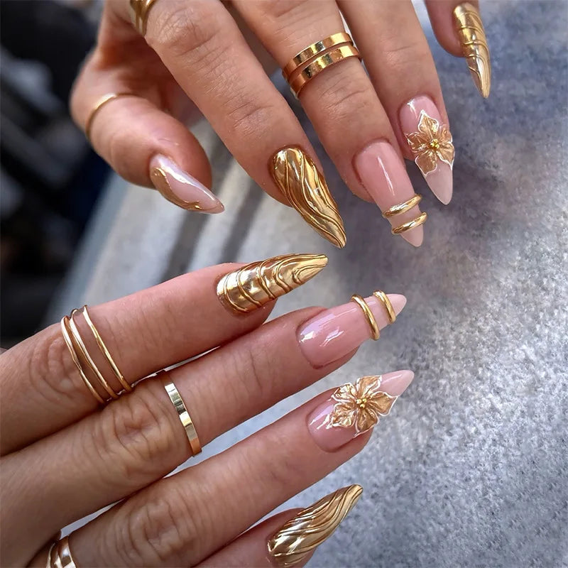 Metallic and embellished nails shown on hands