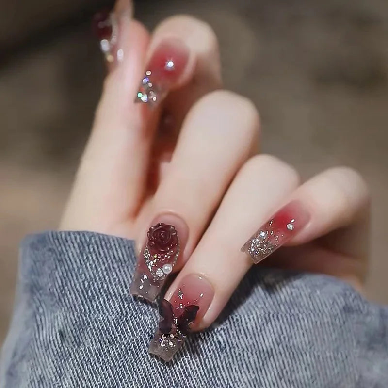 Decorated press-on nail designs shown on hands