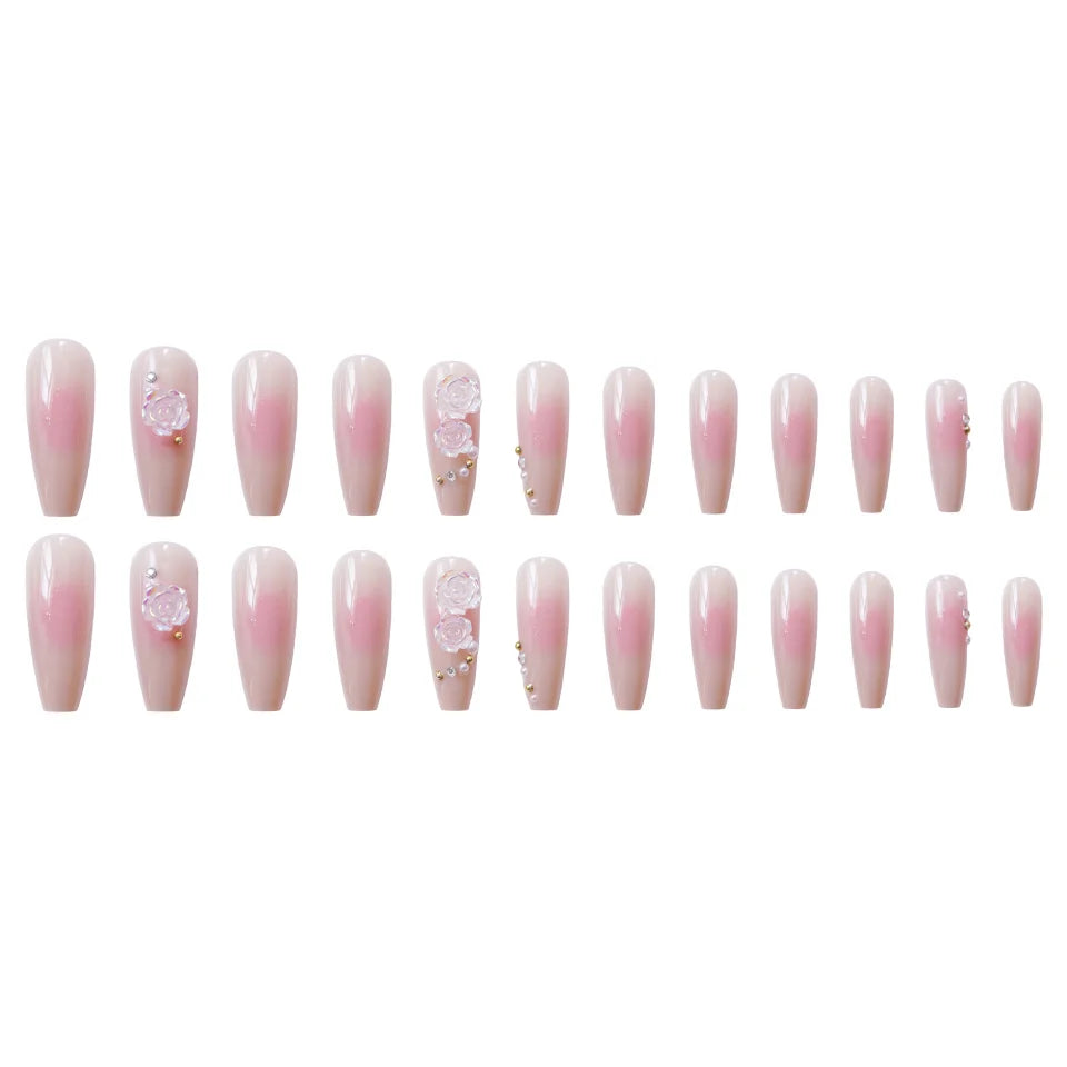 Pink decorative press-on nails arranged in rows