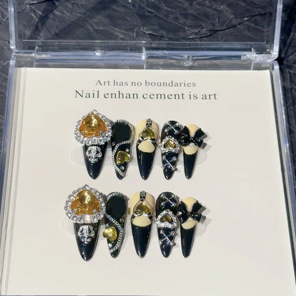 Decorated press-on nail sets with raised embellishments on display cards