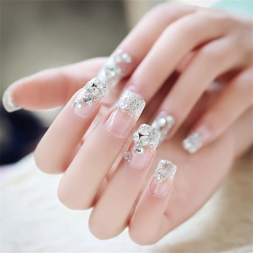 Decorated nail designs shown on hands