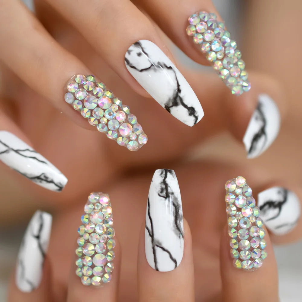 Rhinestone-decorated nail designs shown on hands