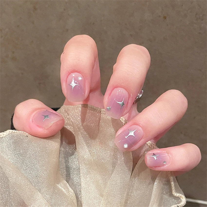 Decorated nail designs shown on hands