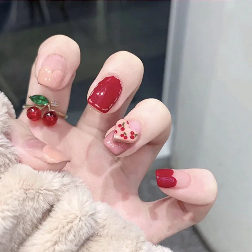 Decorated nail designs shown on hands
