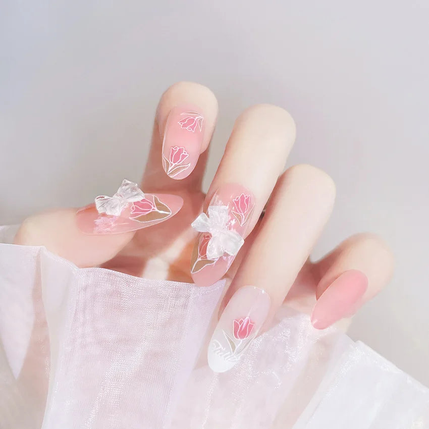 Decorated nail designs shown on hands