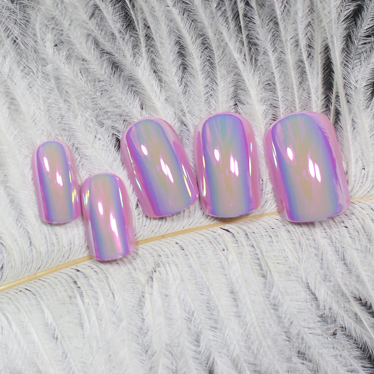 Purple chrome press-on nails arranged in a row