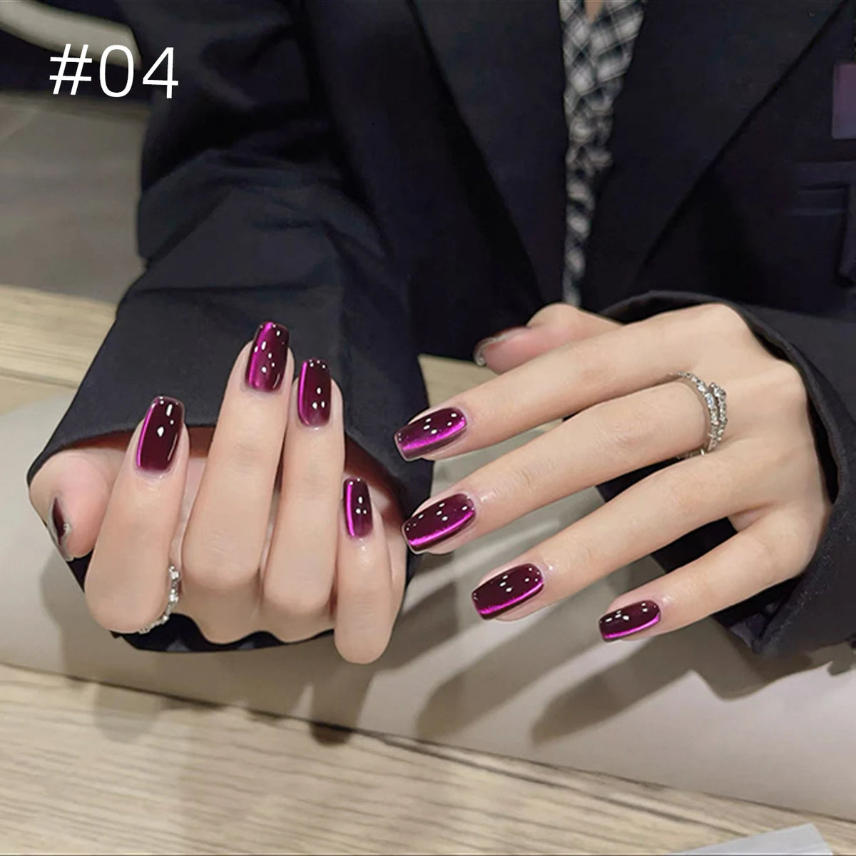 Numbered chrome nail shade shown on hands