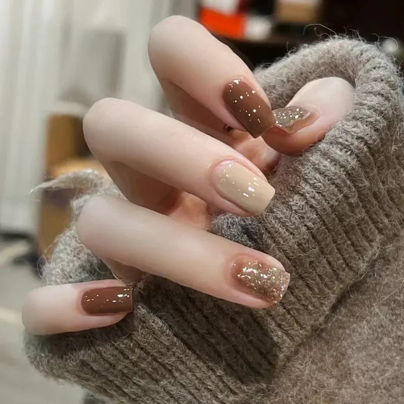 Decorated nail designs shown on hands