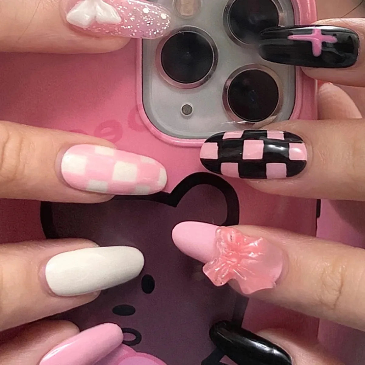 Decorated nail designs shown on hands