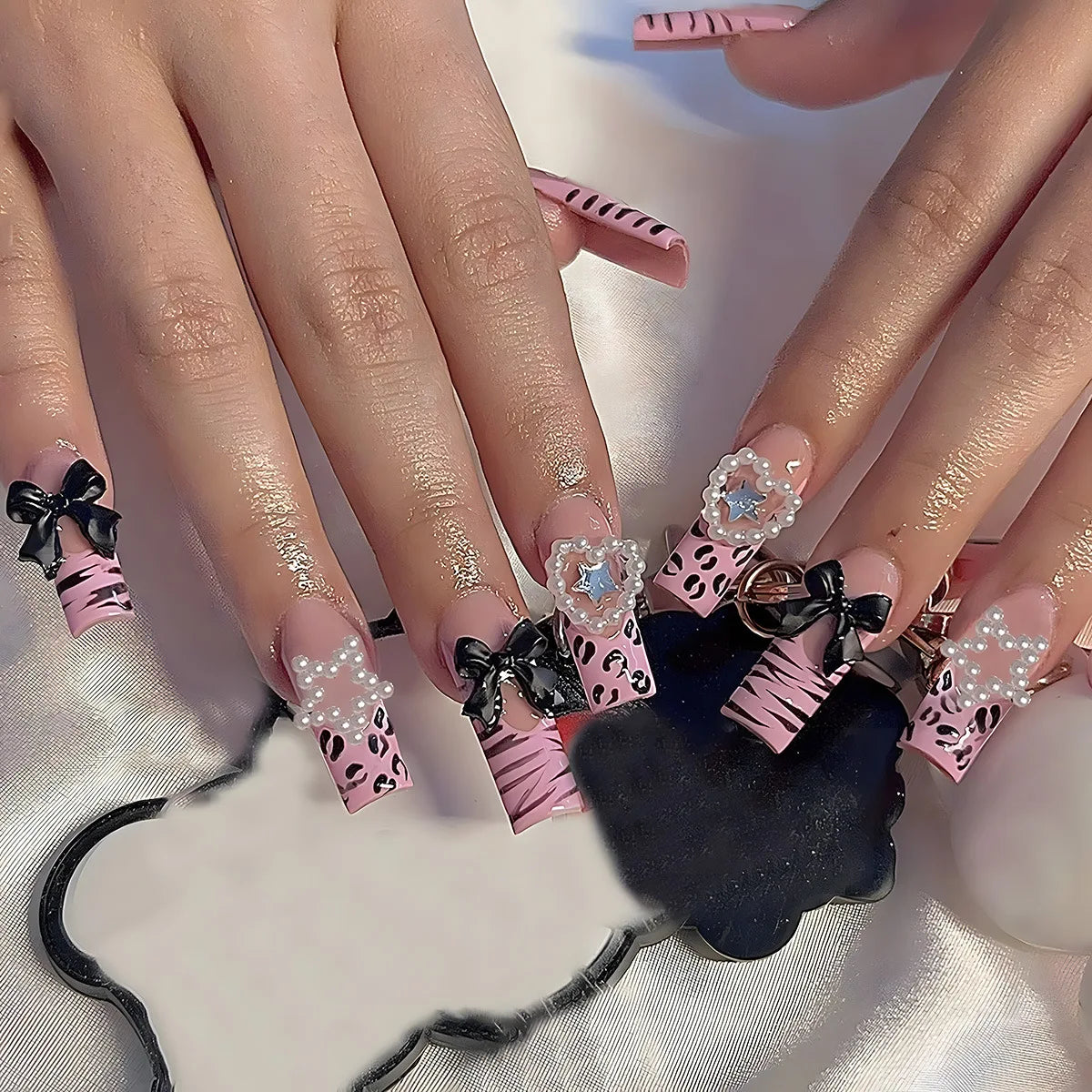 Decorated nail designs shown on hands