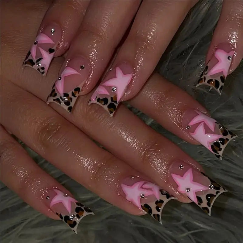 Decorative nail designs with raised accents shown on hands