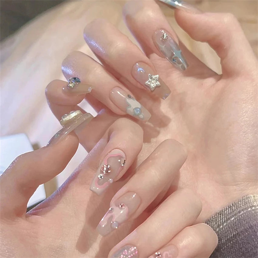 Decorated nail designs shown on hands