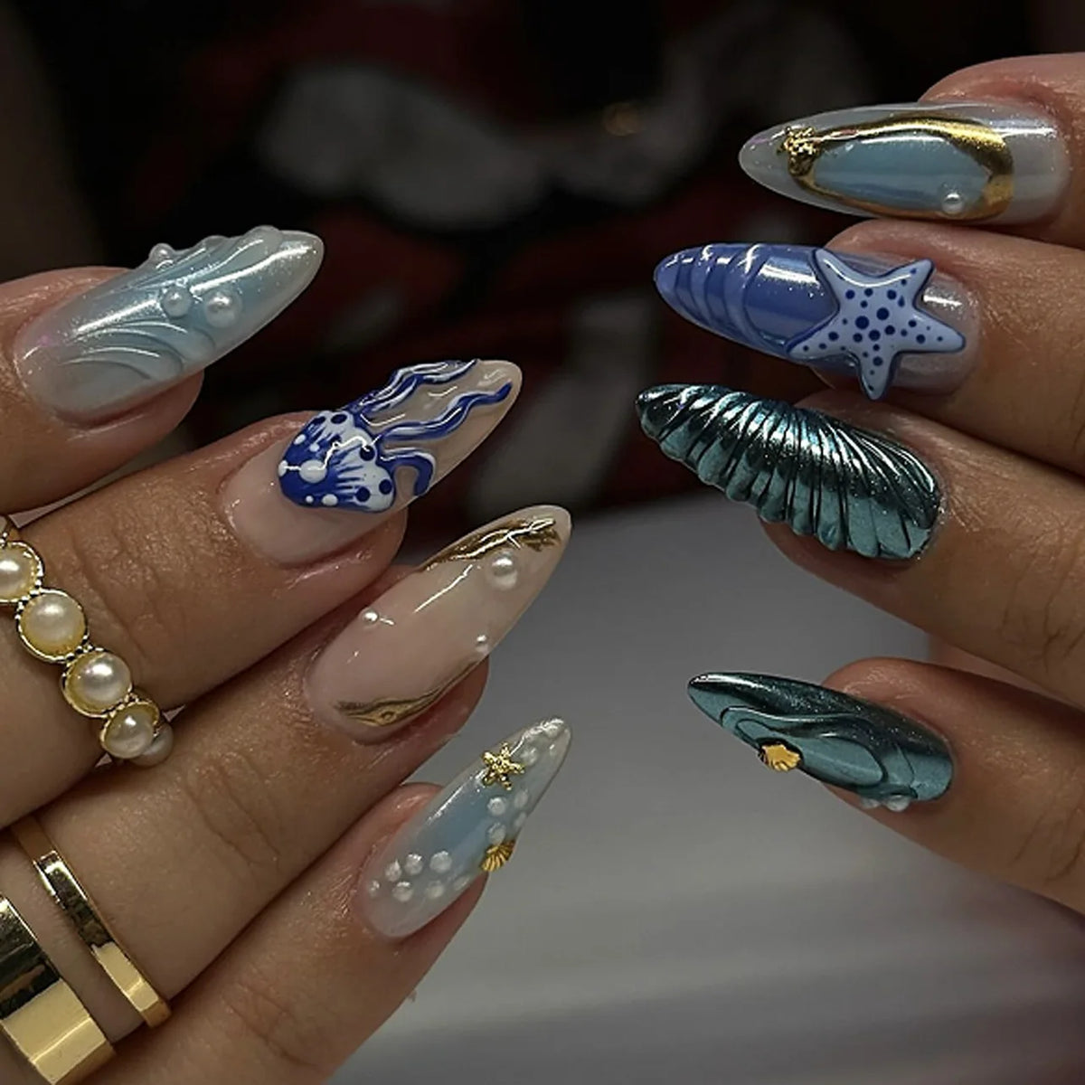 Decorated nail designs shown on hands