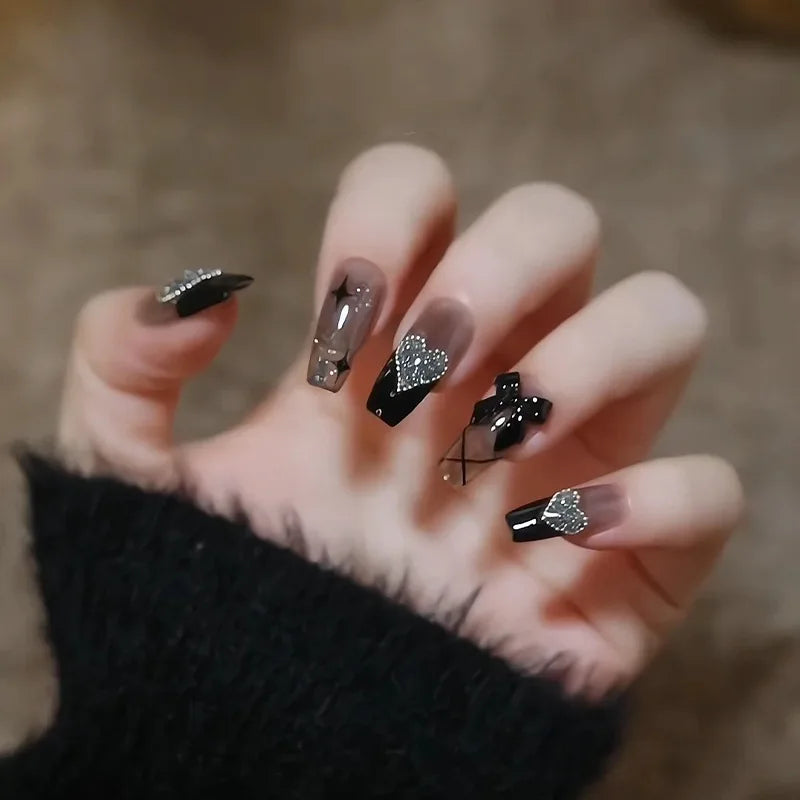 Decorated press-on nail designs shown on hands