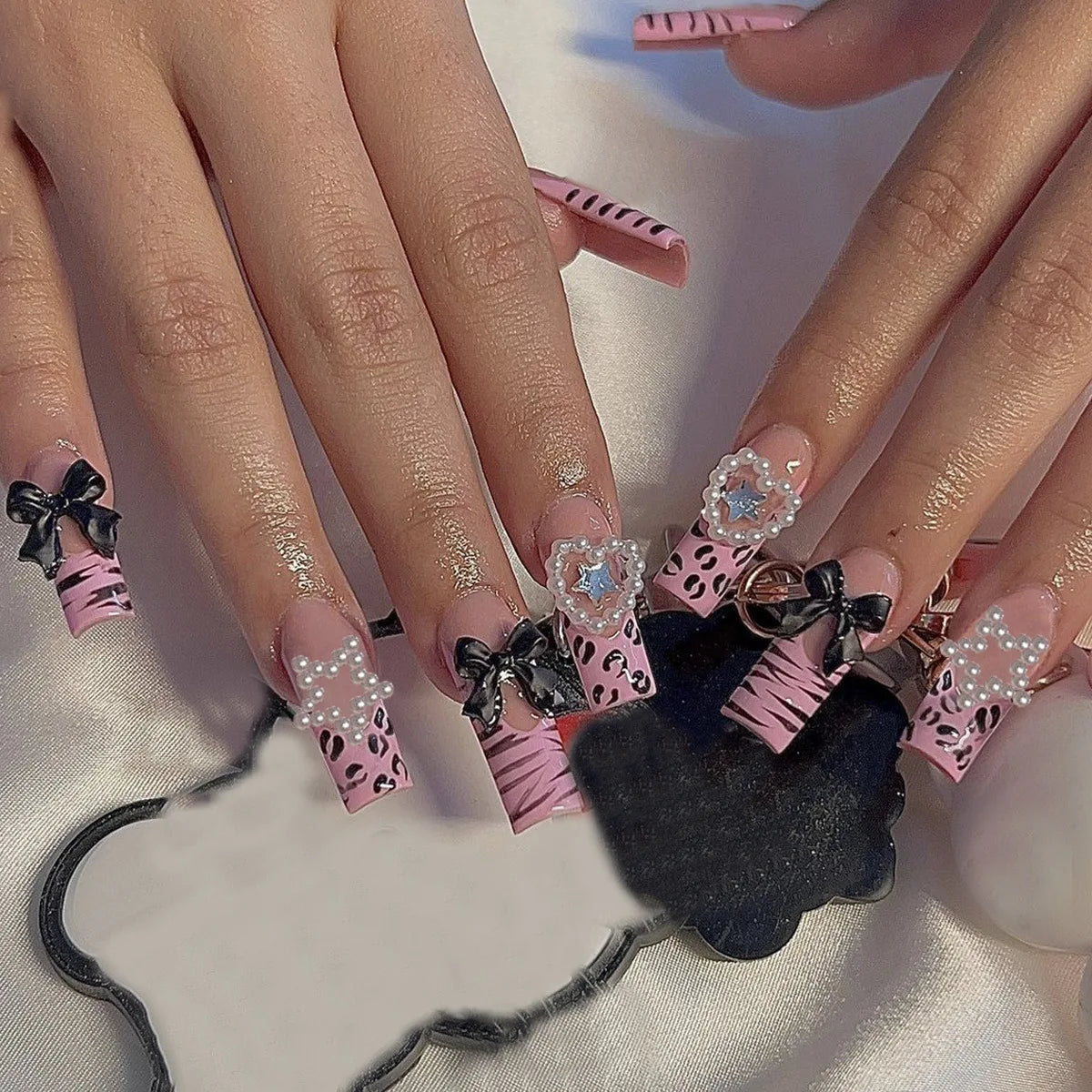 Decorated nail designs shown on hands